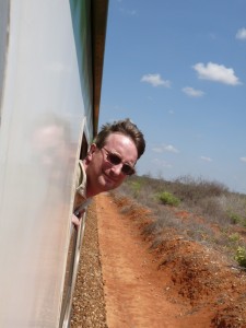 man watching out of a train window